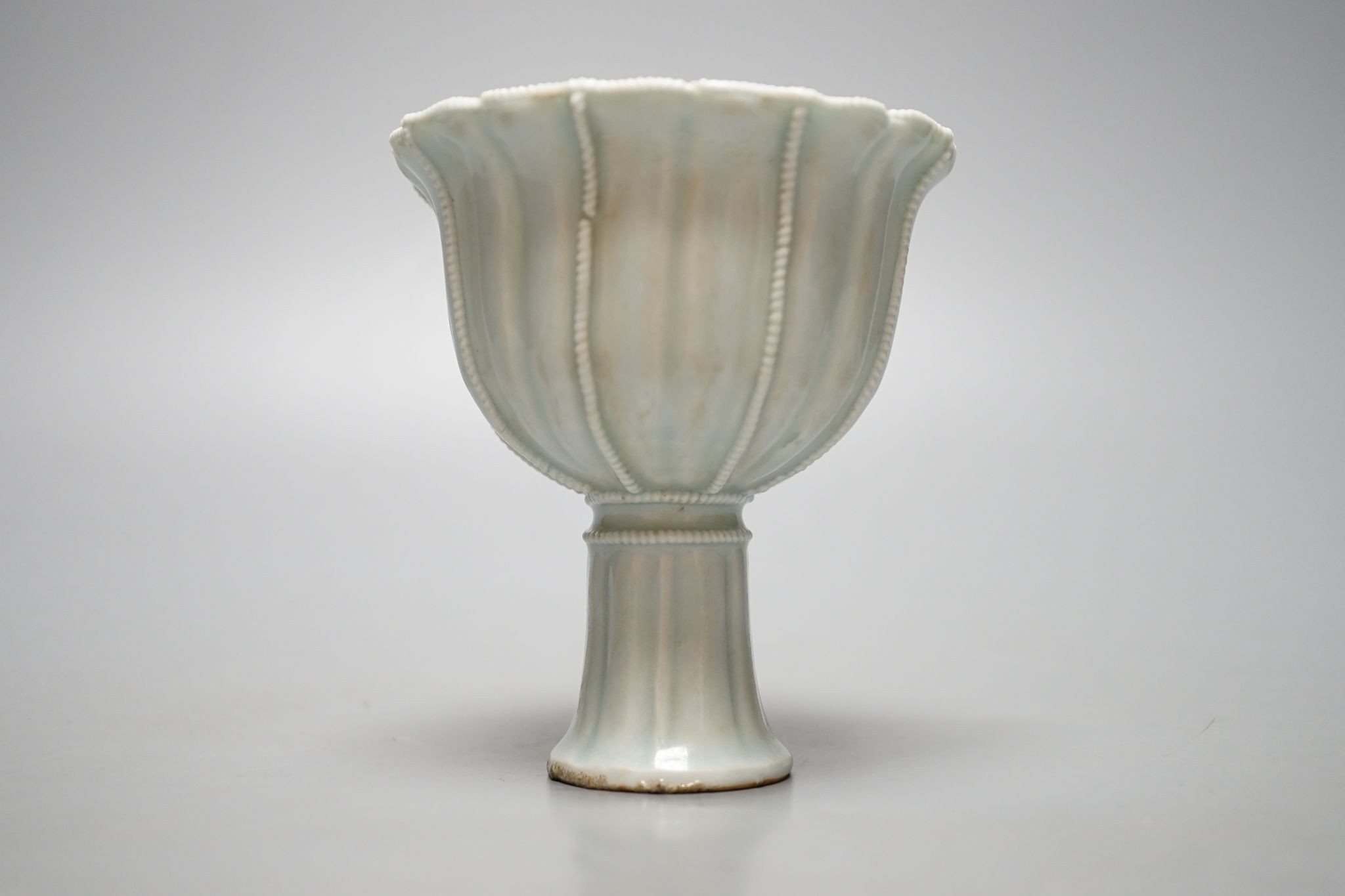 A Chinese Qingbai type stem cup., 10 cms high.